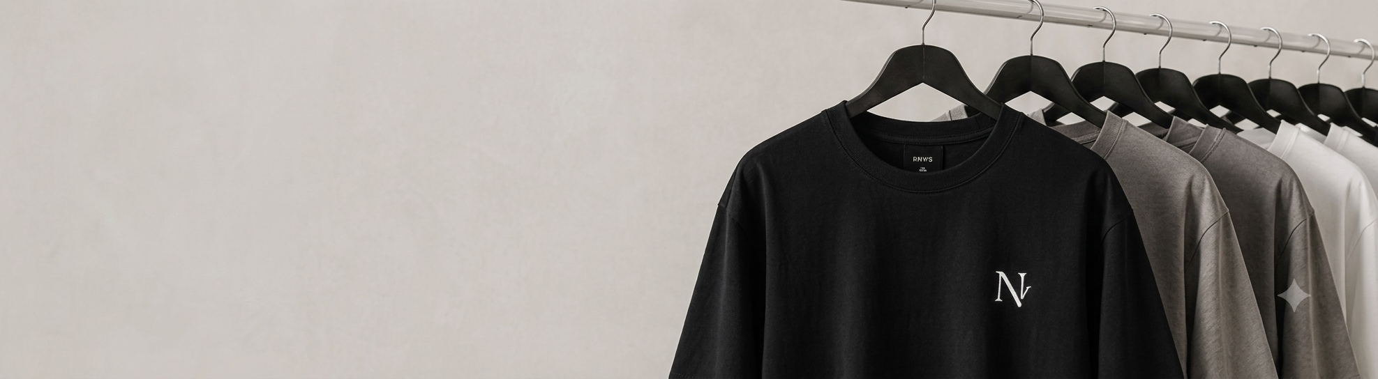 Rack of Norvio Vale oversized tees in multiple colorways